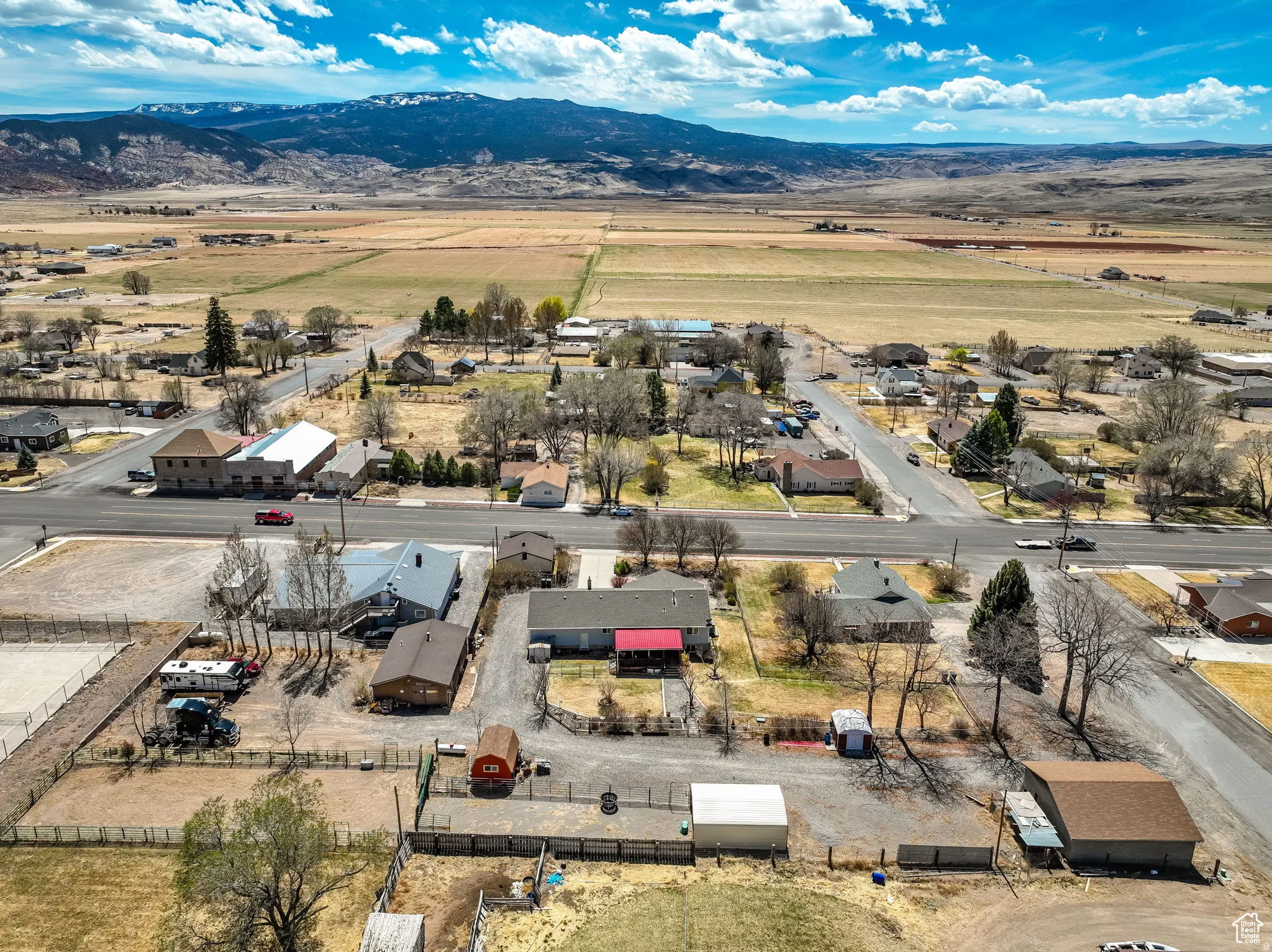 Aerial perspective featuring a rural town with a distant mountain range