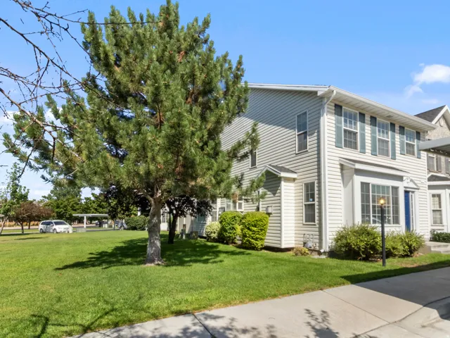 Two-story exterior with horizontal siding and decorative window shutters