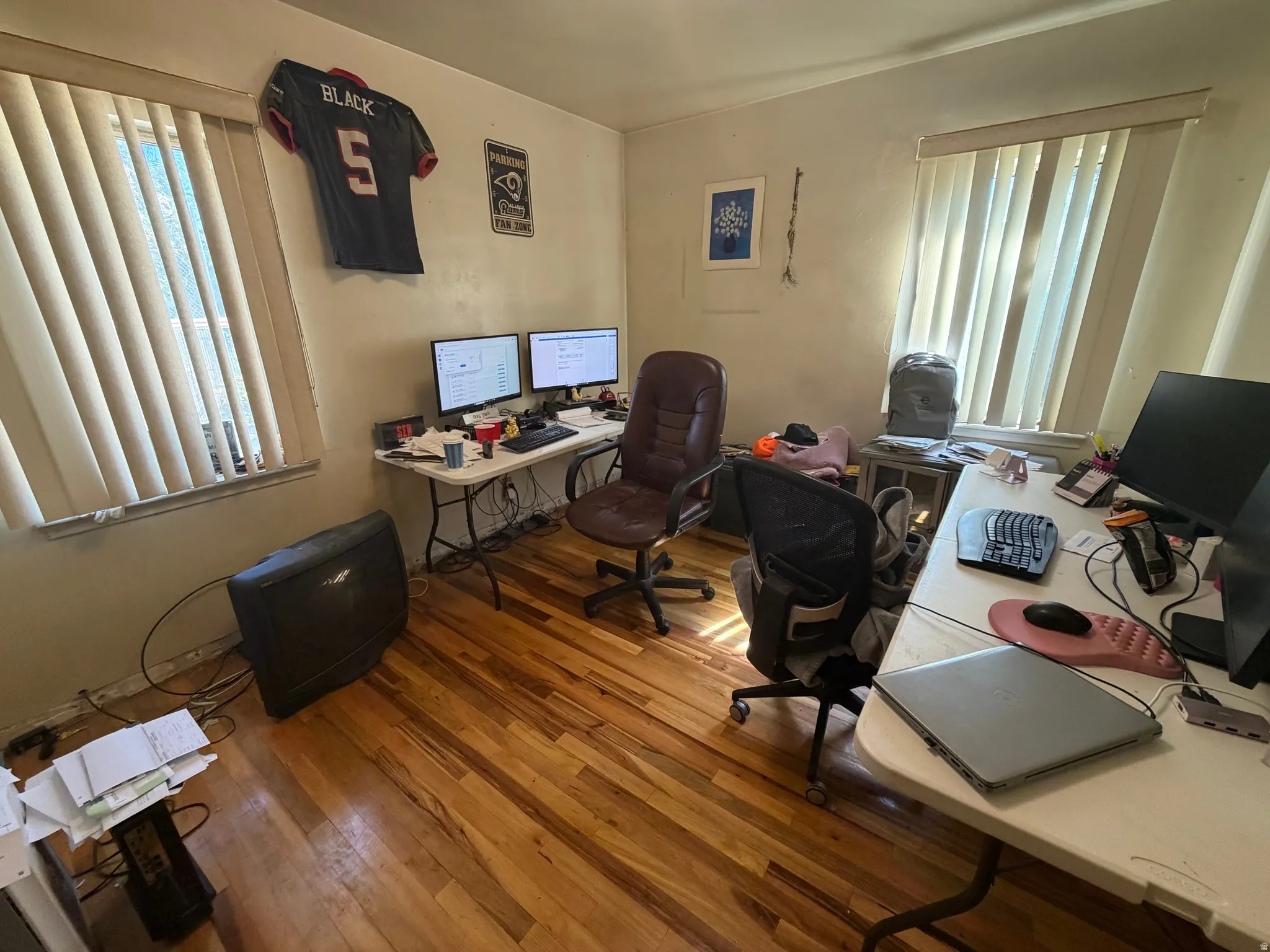 Hardwood-finish flooring throughout the room