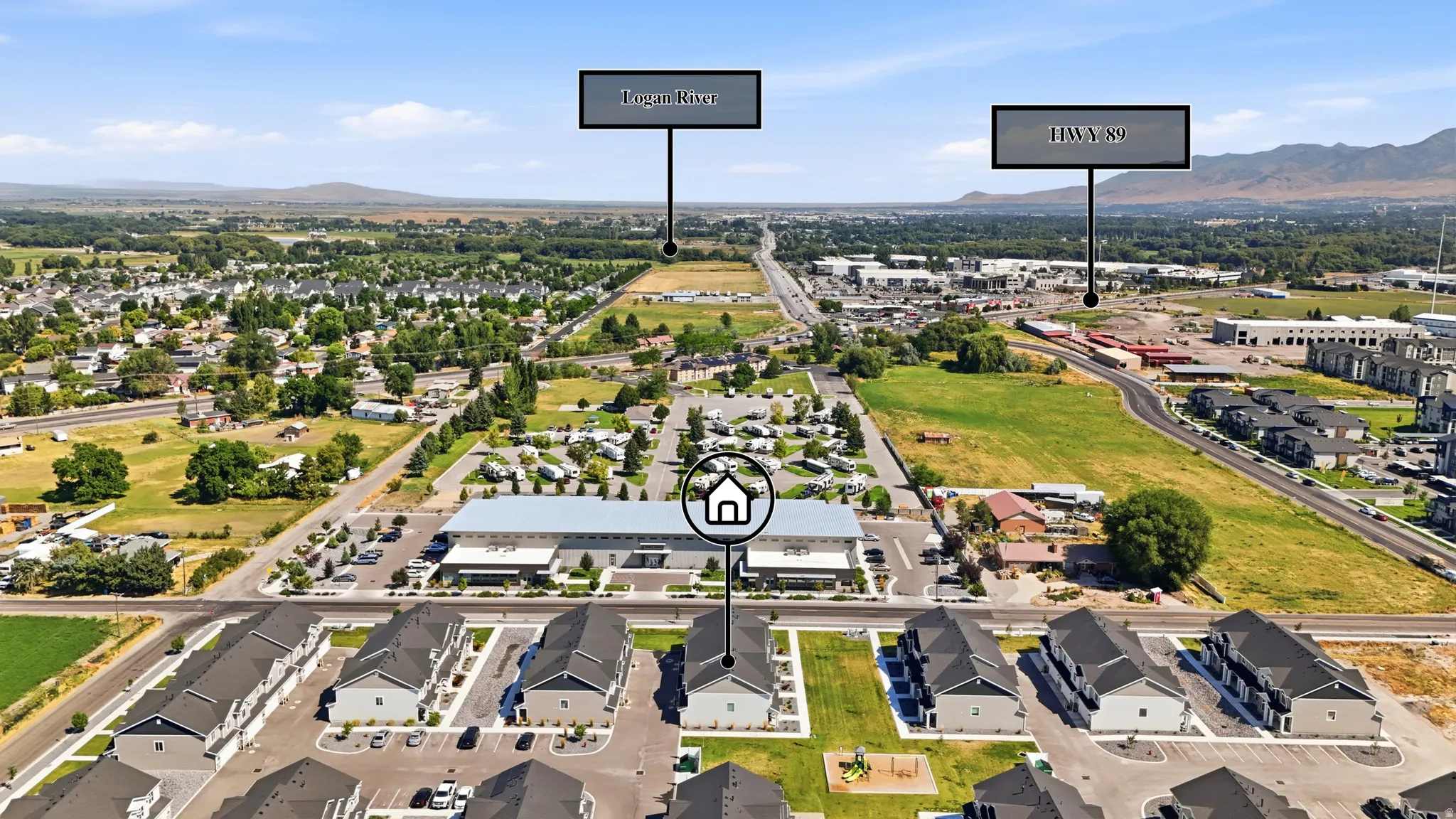 Aerial perspective showcasing a modern residential development with a mountain backdrop