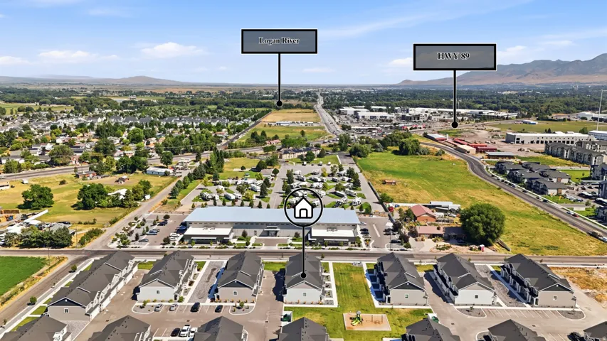 Aerial perspective showcasing a modern residential development with a mountain backdrop