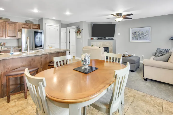 Open-concept living space featuring a dining area, kitchen, and living room