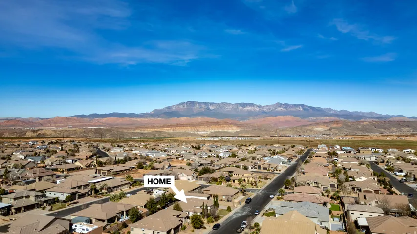 Aerial perspective showcasing a residential neighborhood with arid mountain backdrops
