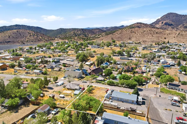 Expansive lot featuring mature trees and a clear perimeter, situated within a developing community