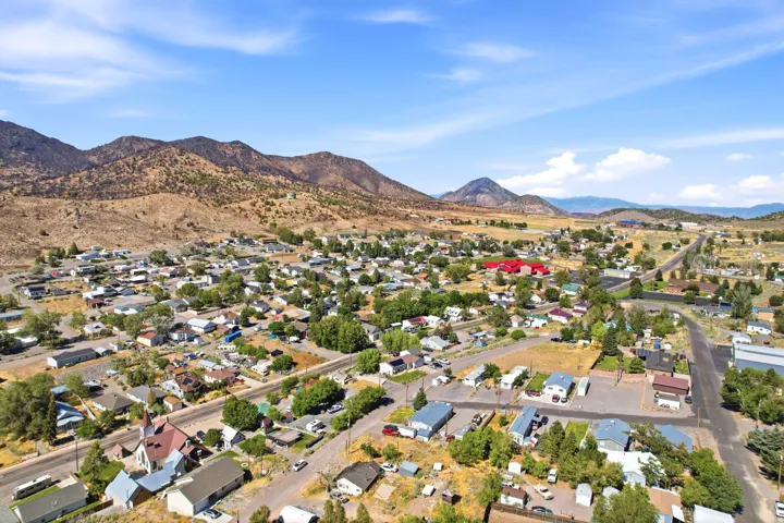 Townscape with varied residential and commercial structures under a clear sky