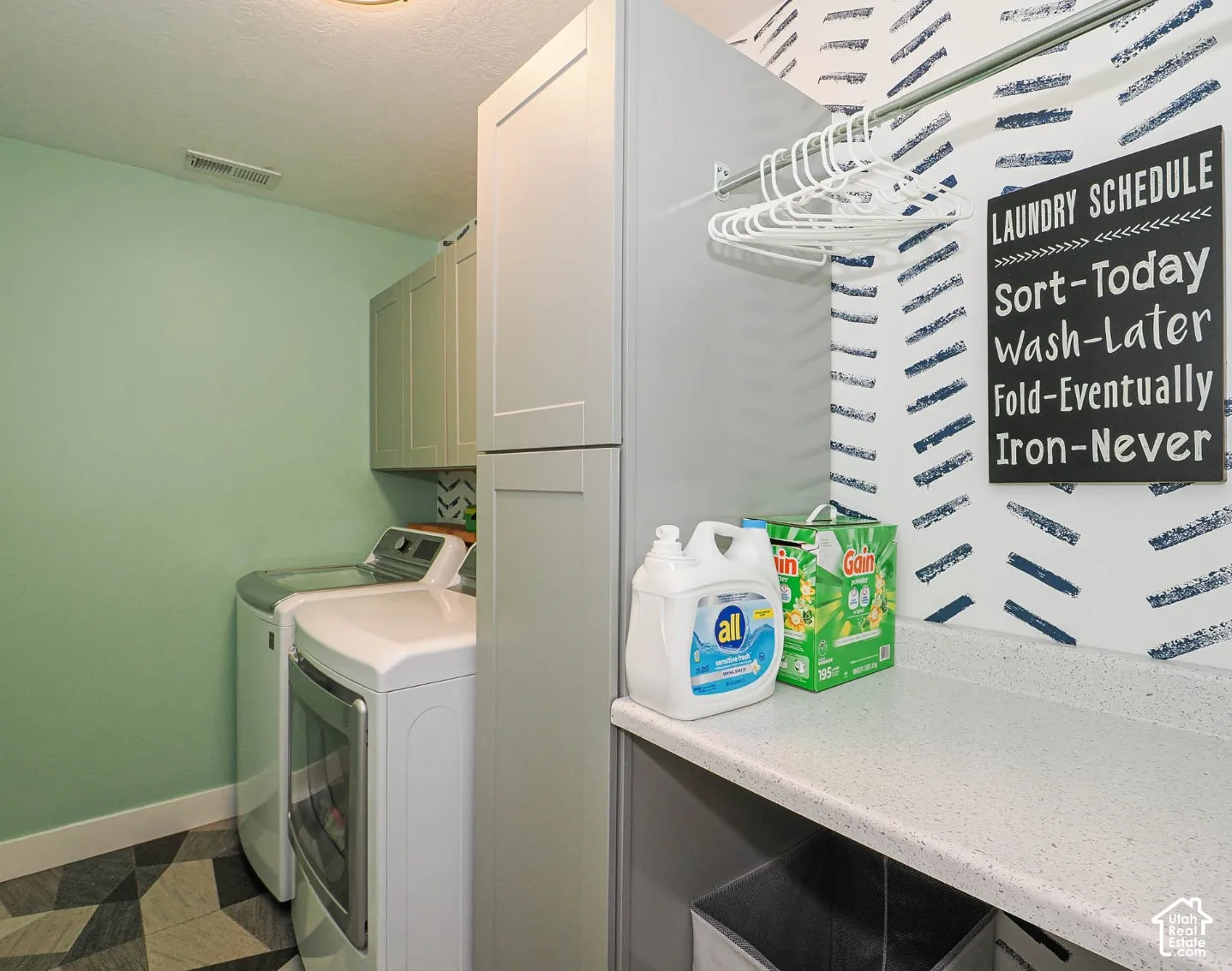 Laundry room with storage and space to fold laundry