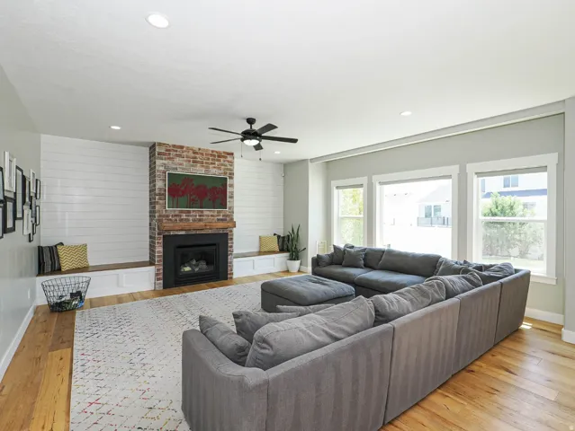 Open great room with fireplace & TV connections. Storage for electronic components  behind the TV