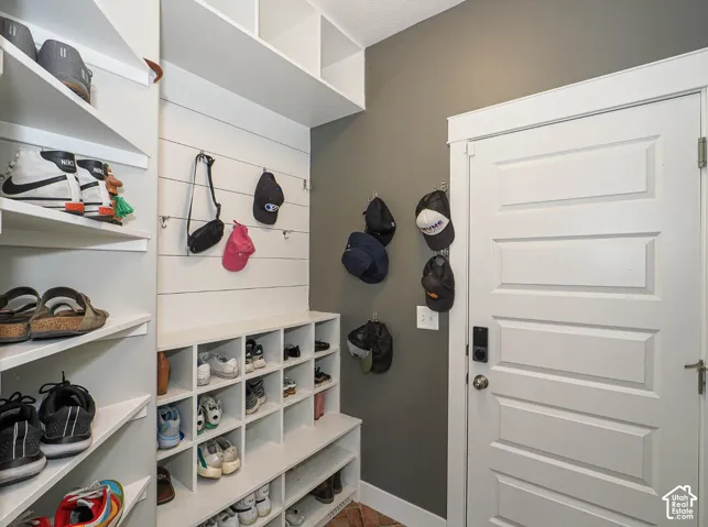 Many places to hang and store your gear in this mud room off the garage