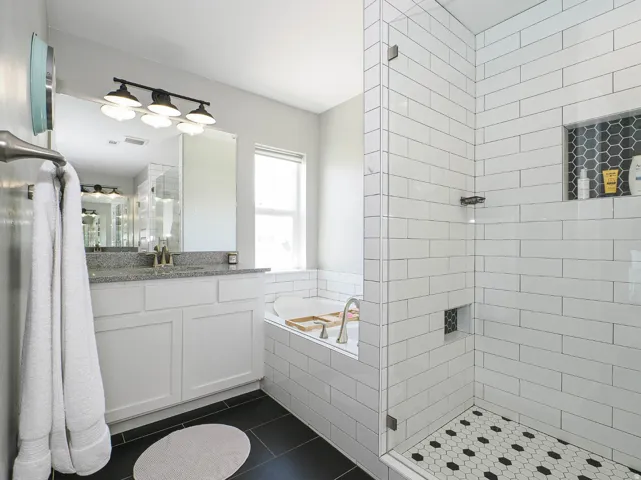 Soaking tub next to the walk in shower