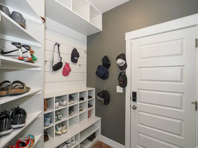 Many places to hang and store your gear in this mud room off the garage