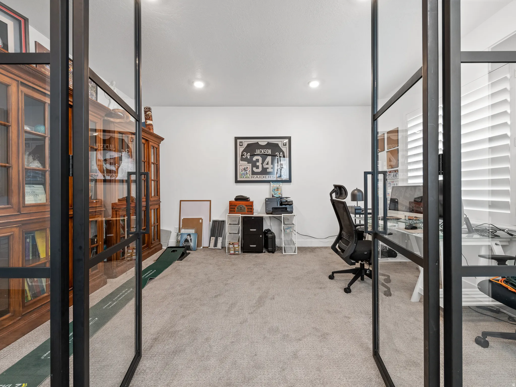Room featuring light gray carpet flooring and white walls