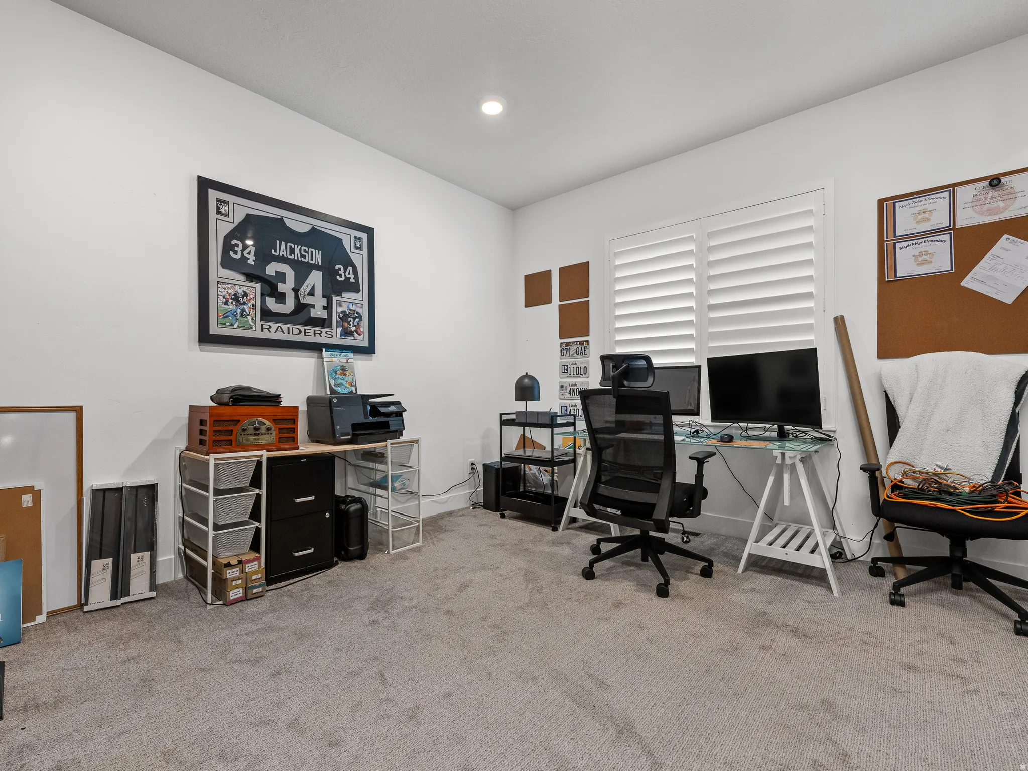 Versatile room with plush carpet flooring and white walls