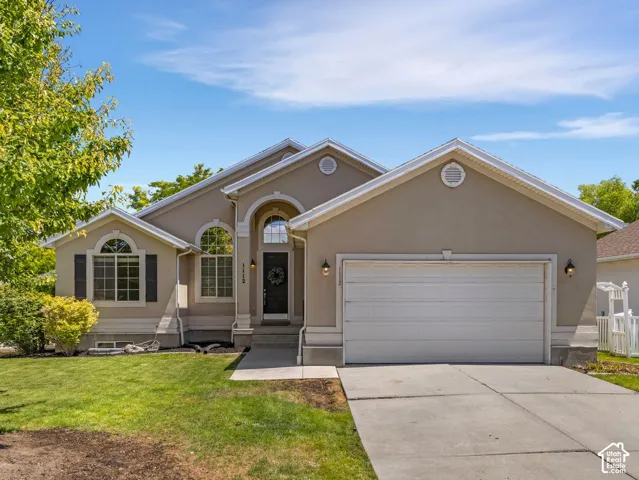 Stucco exterior residence with a two-car garage