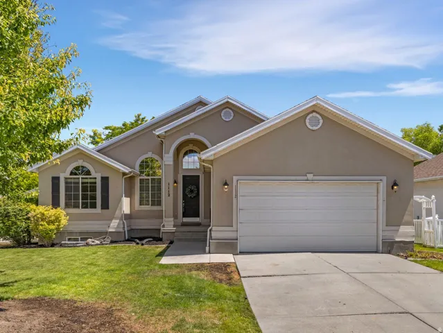 Stucco exterior residence with a two-car garage