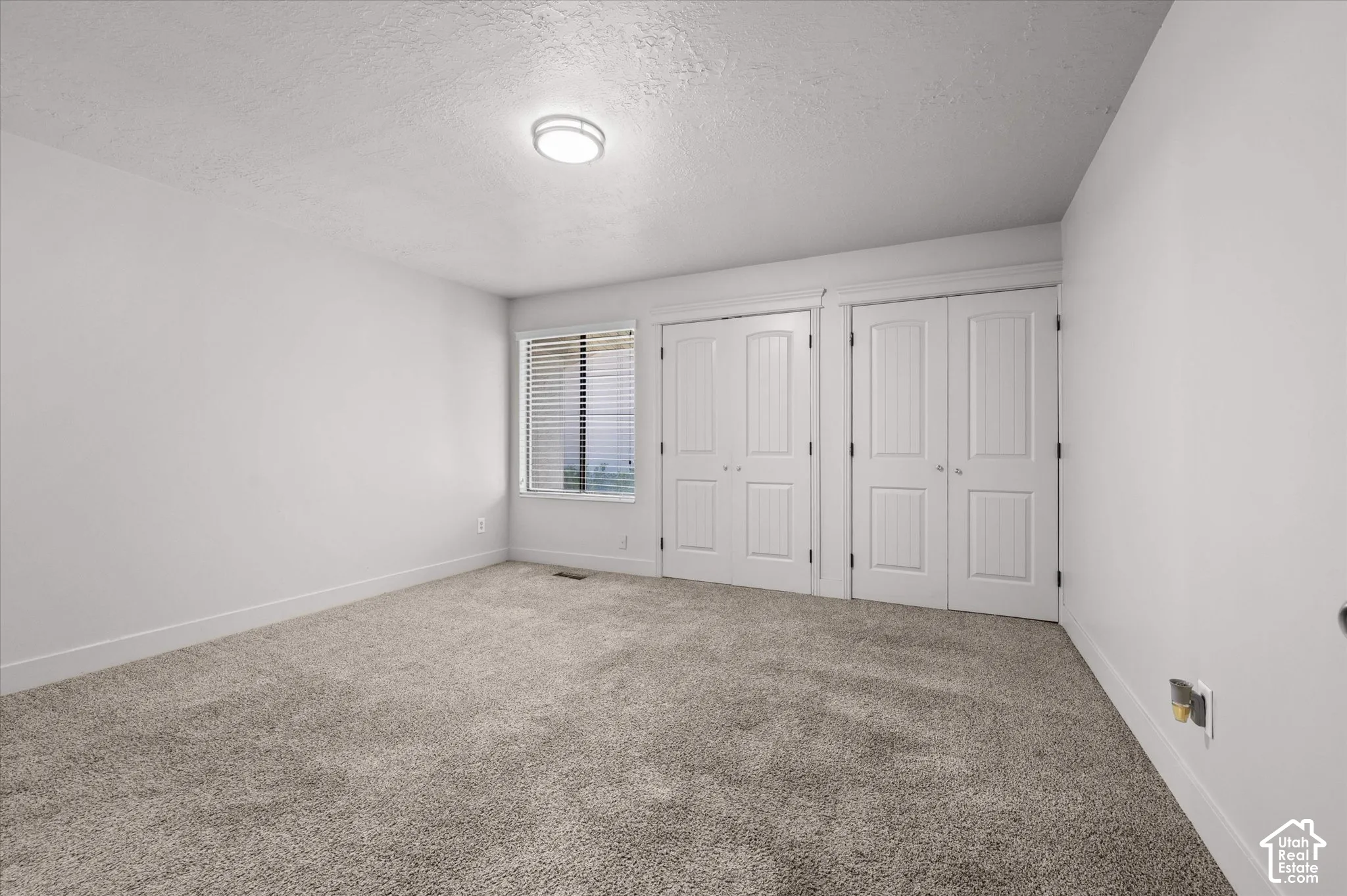 Neutral-toned carpeting throughout