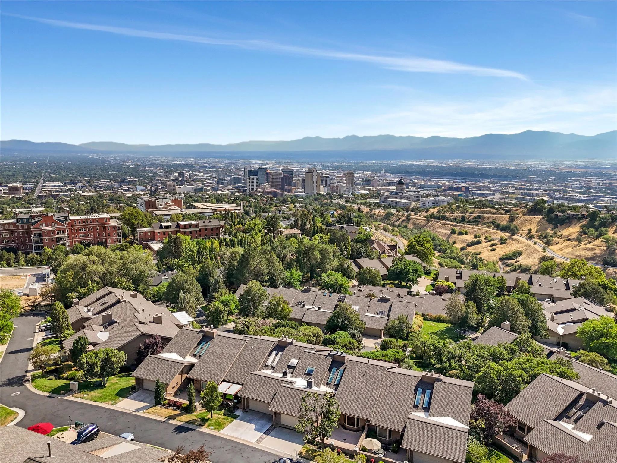 Aerial perspective showcasing residential properties with a mountainous backdrop