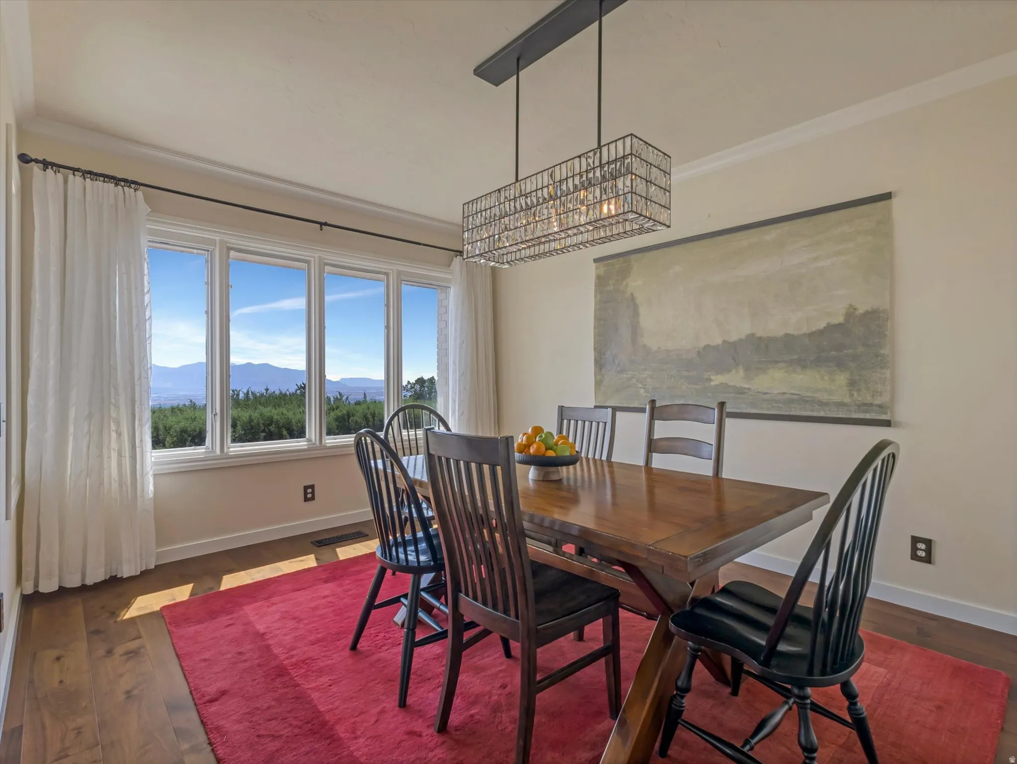 Dining area featuring a multi-pane window array with mountain scenery