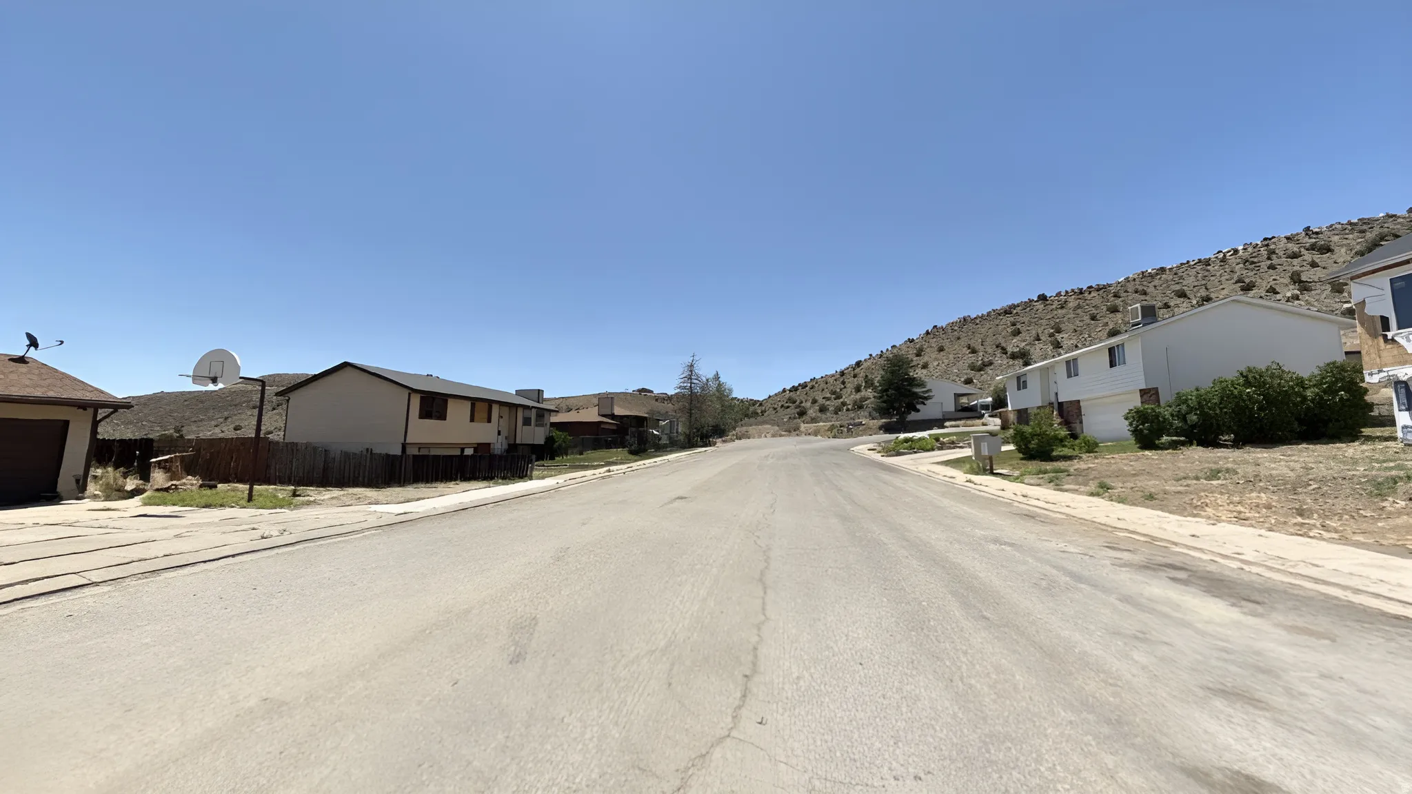 Paved street with hillside landscaping