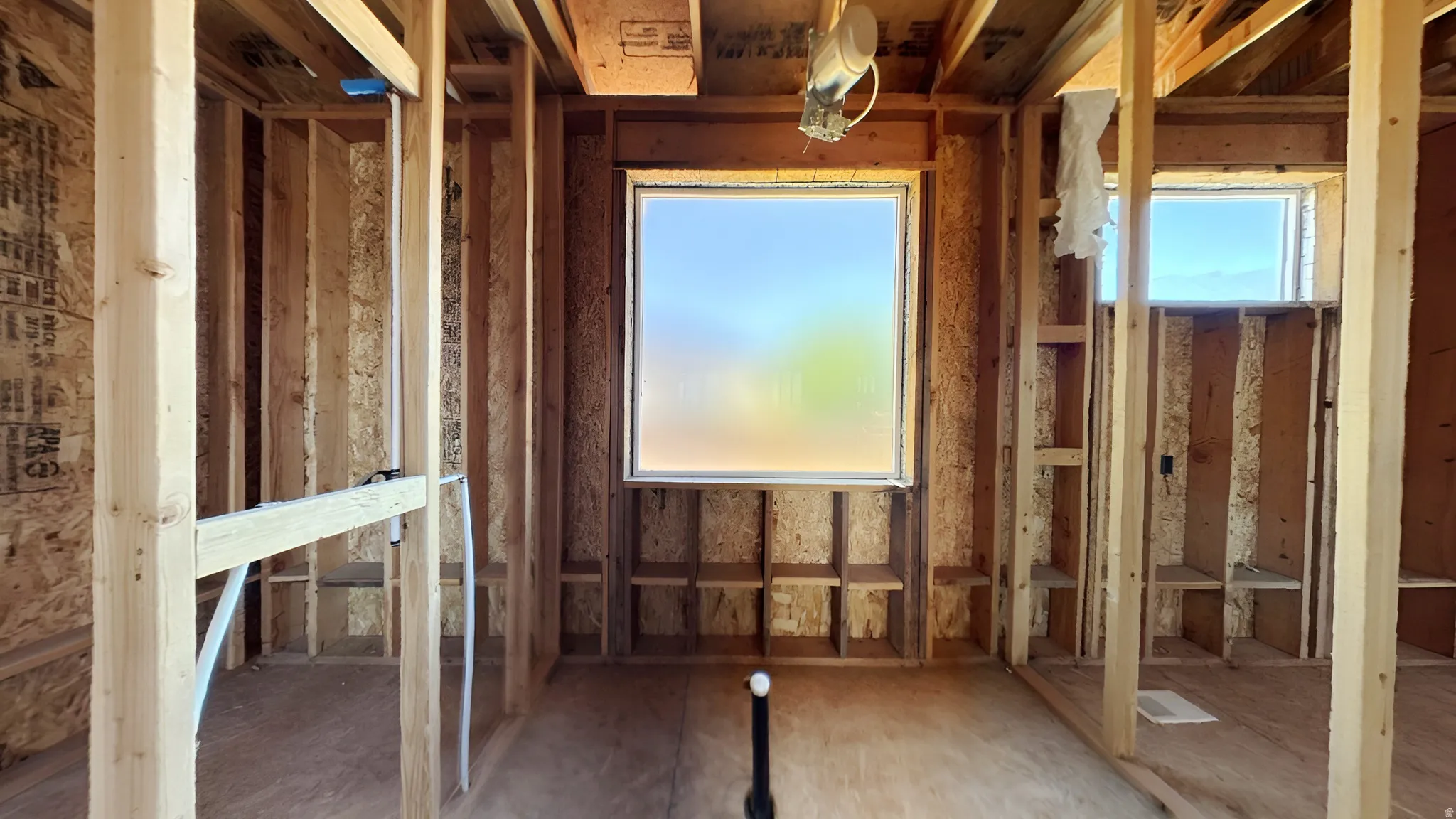 Framed interior space featuring structural lumber and subflooring