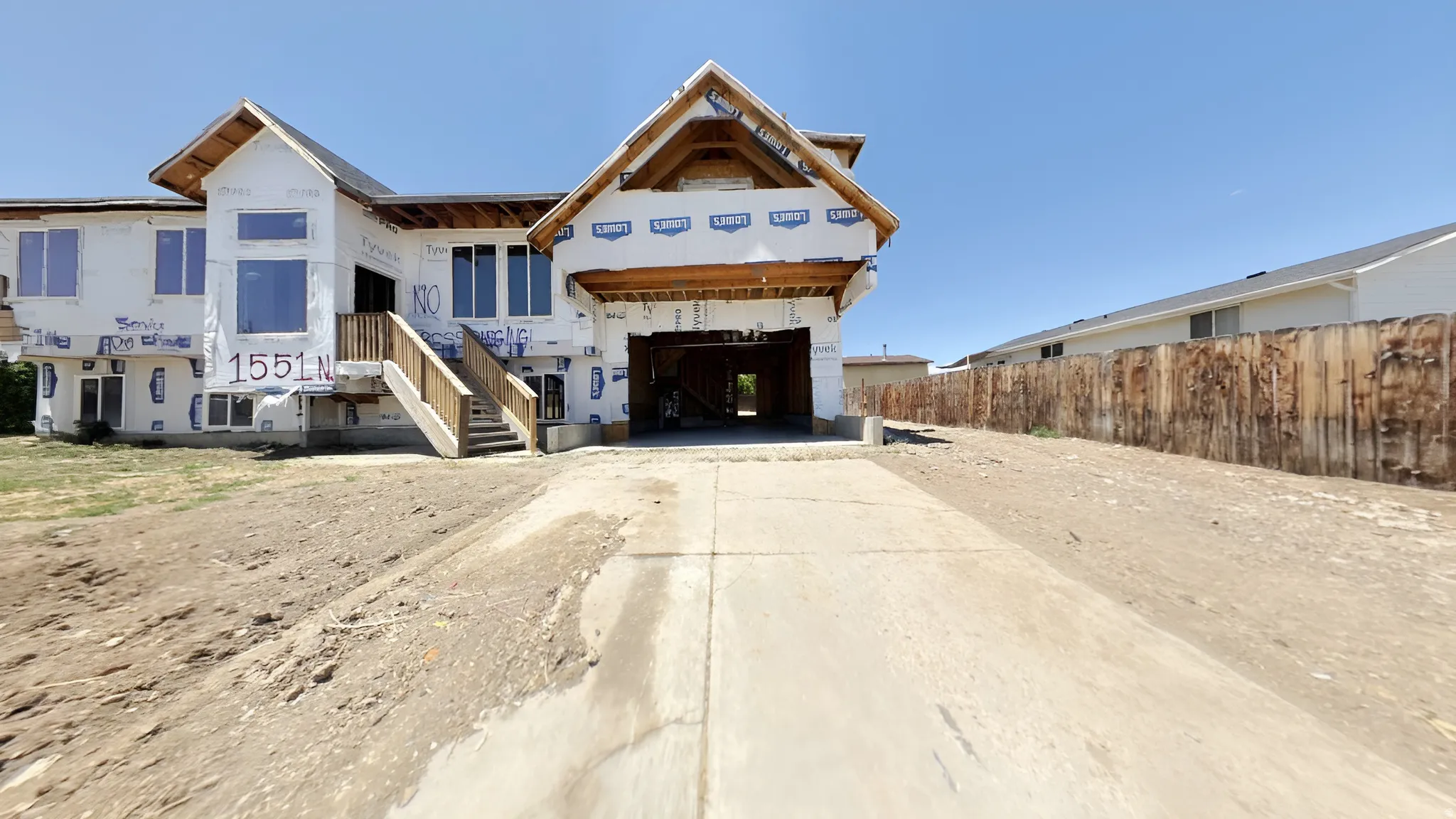 New construction property with a multi-level design, attached garage, and a concrete driveway