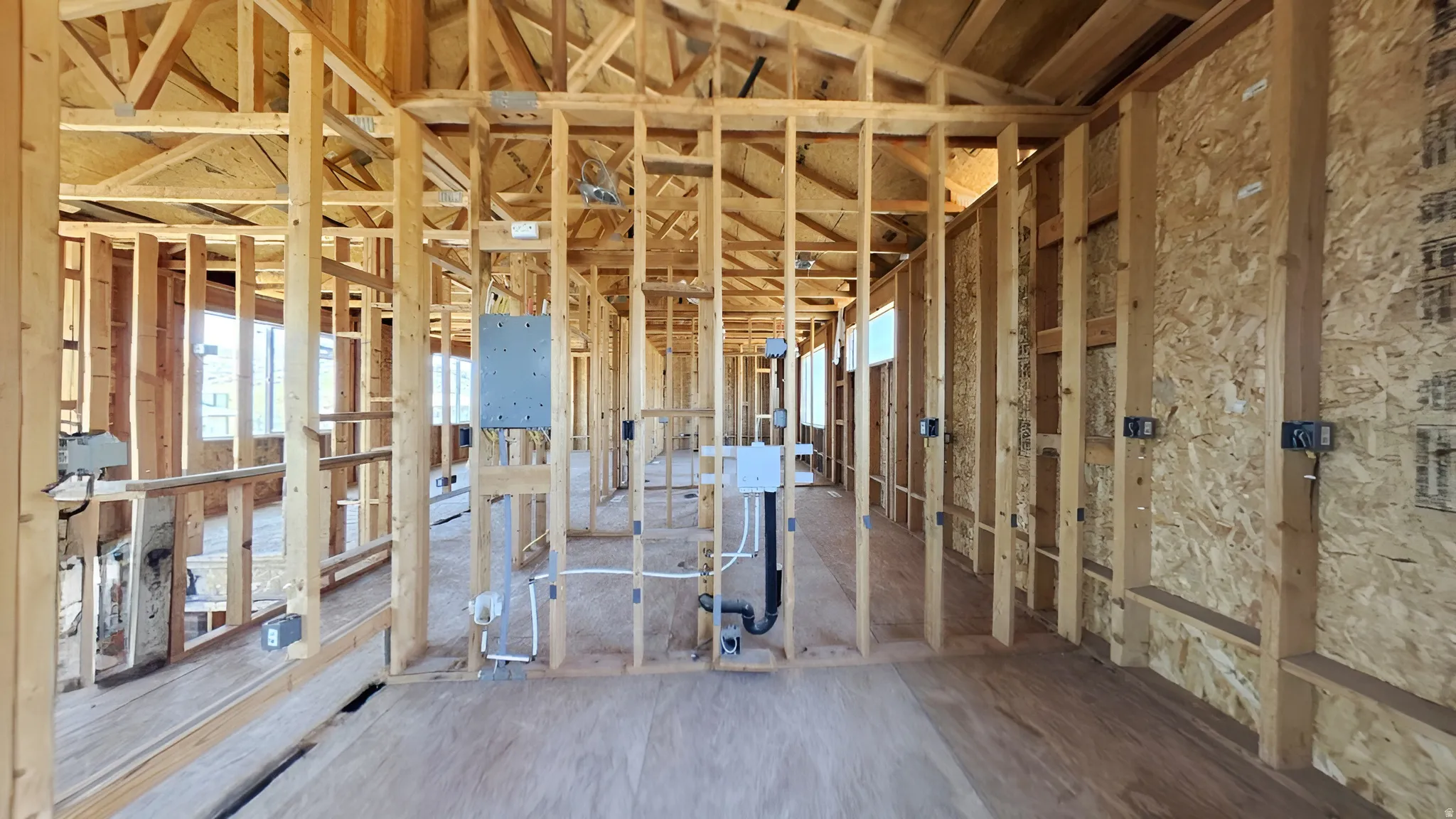 New construction framing showcasing structural wood elements and plywood subflooring