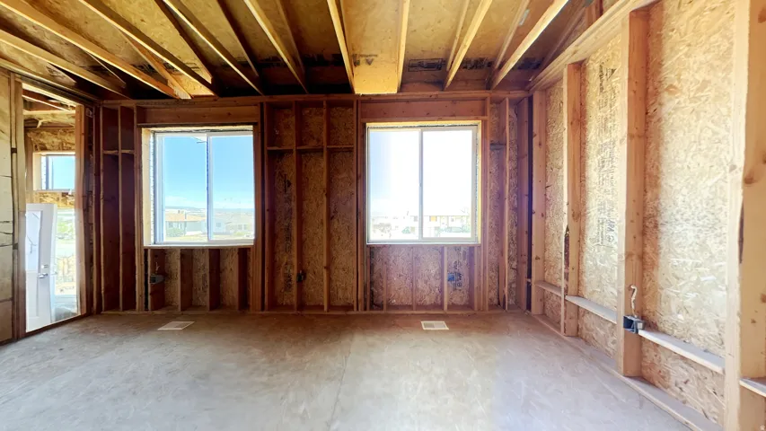Unfinished interior space featuring exposed wood framing and subfloor