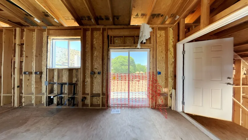 Framed interior space with a sliding glass door and a single-pane window