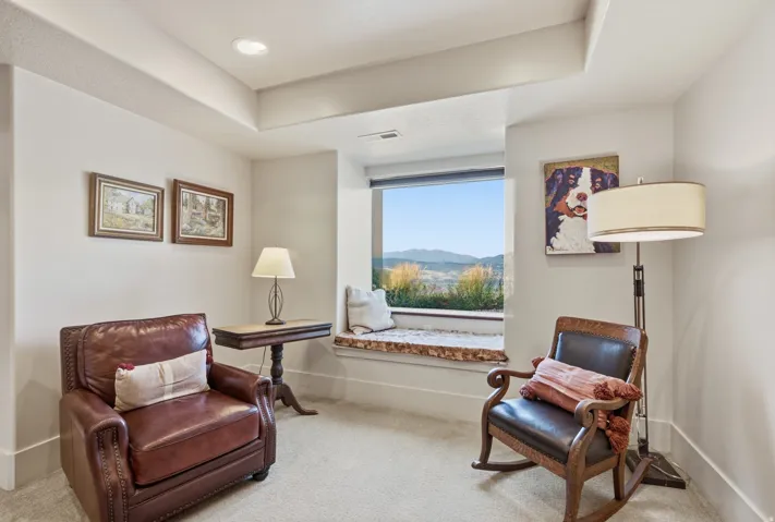 Recessed window seating featuring a wood-finish sill, integrated window, and distant mountain scenery