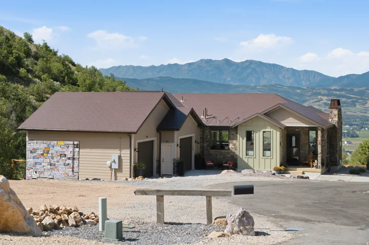 Craftsman-style exterior featuring a multi-tone facade with stone accents and horizontal siding