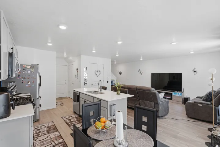 Open-concept living space featuring wood-finish flooring throughout