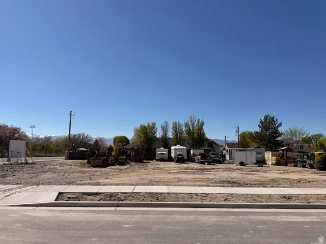 Cleared lot with established sidewalks and street frontage