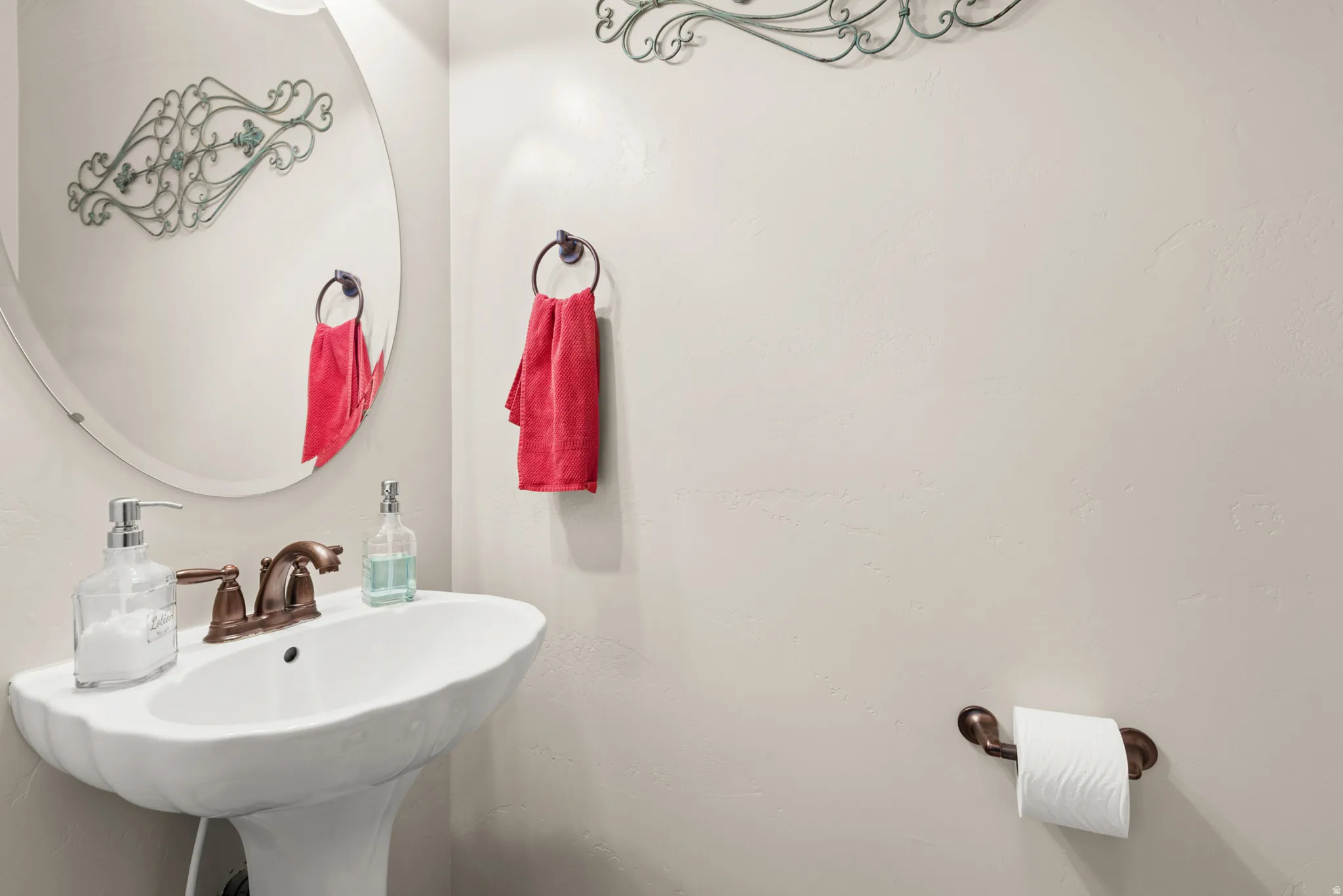 Pedestal sink with bronze-finish faucet