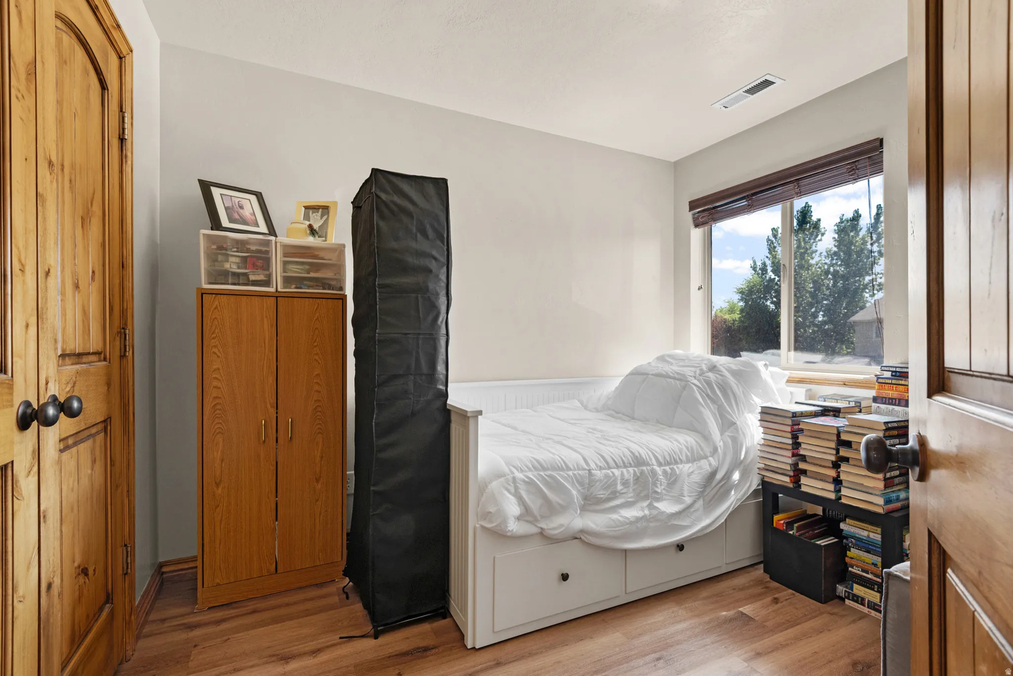 Light-toned walls complement wood-finish flooring