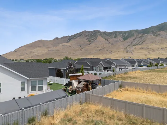 Expansive mountain backdrop framing residential properties