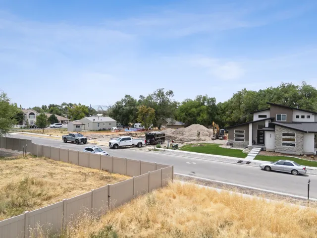 Modern architectural exterior featuring stone and horizontal siding accents