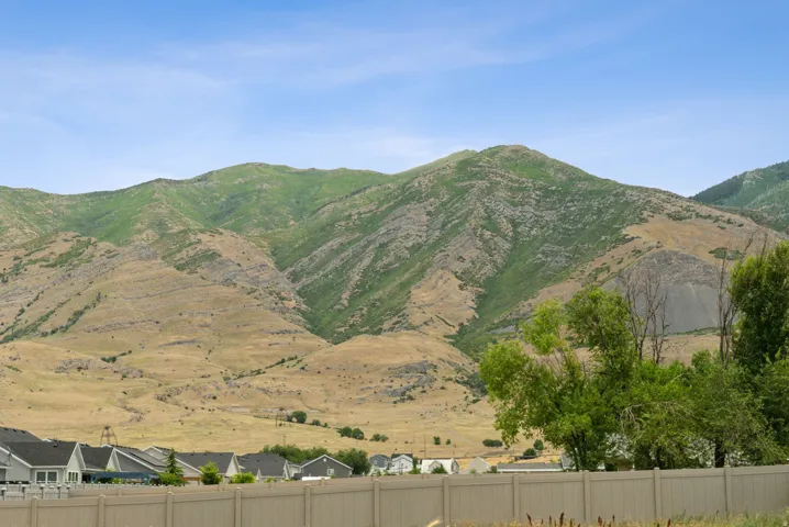 Mountain backdrop featuring varying elevations and natural vegetation