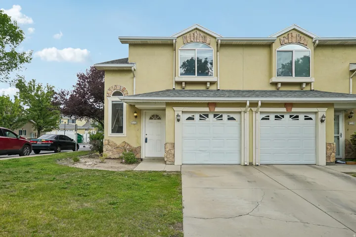 Stucco exterior with stone accents and arched window details