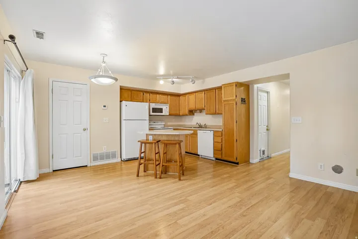 Open concept living space featuring light wood-finish flooring