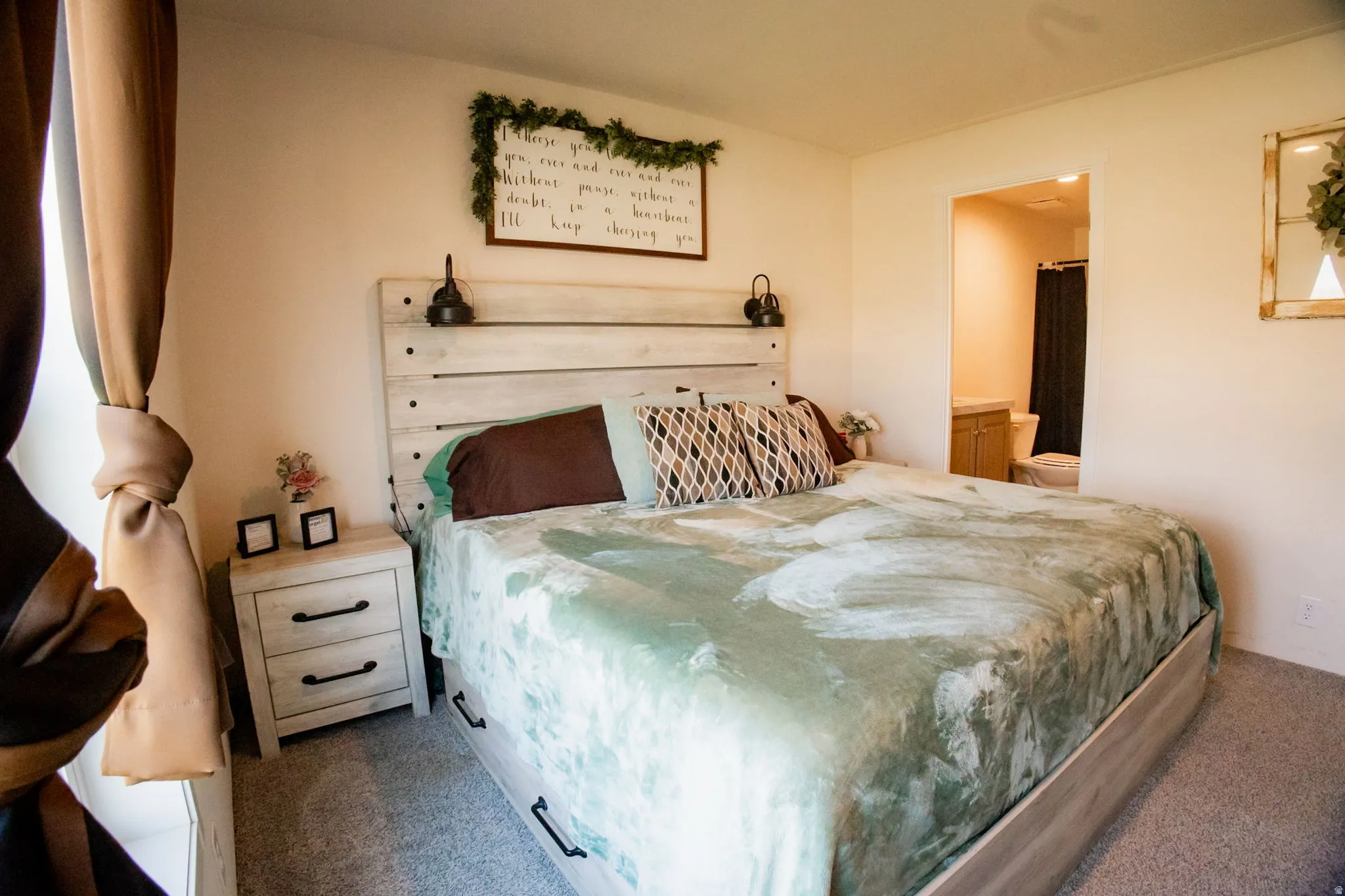 Bedroom featuring light-toned walls and grey carpeting