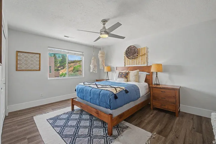 Bright room featuring wood-finish flooring and white walls