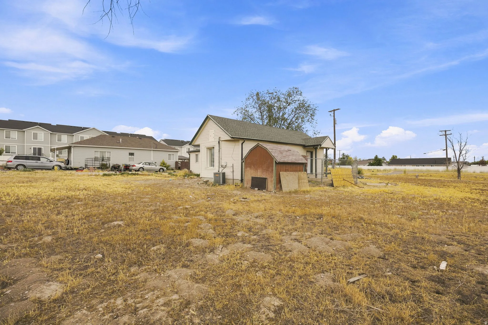 Expansive lot featuring a detached structure and a small shed