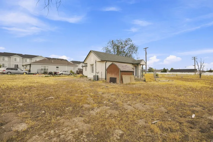 Expansive lot featuring a detached structure and a small shed