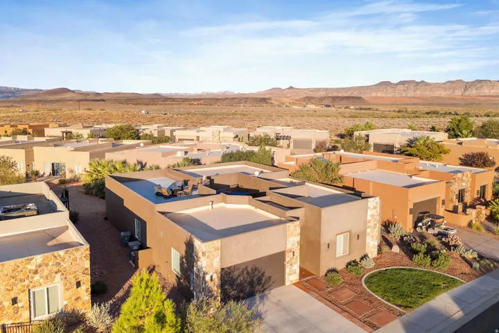 Contemporary stucco exterior with stone accents and flat roofline