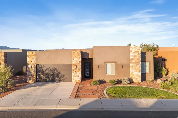 Contemporary stucco exterior with stone accents