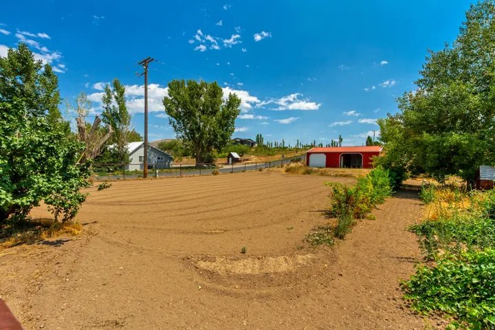 Expansive tilled ground with visible rows