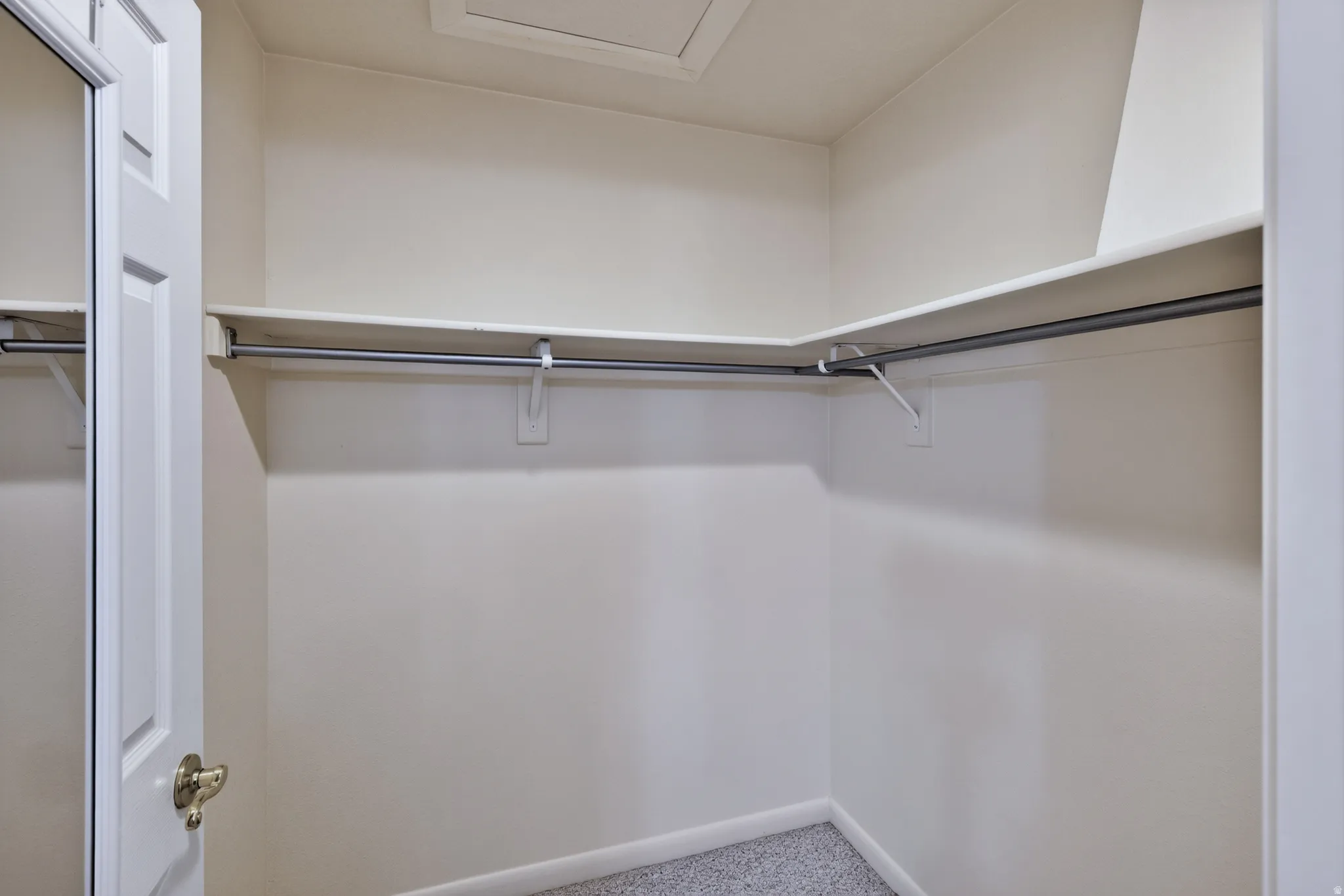 Built-in closet shelving with integrated hanging rods