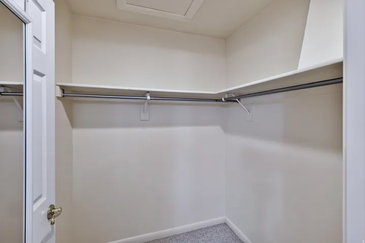Built-in closet shelving with integrated hanging rods
