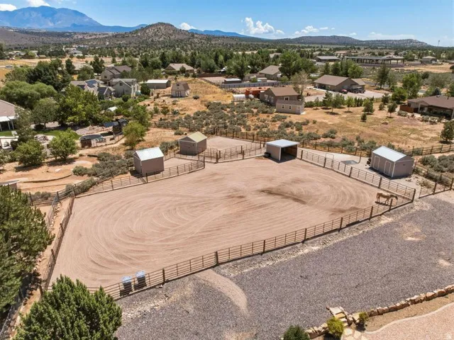 Expansive equestrian arena featuring sand footing and perimeter fencing