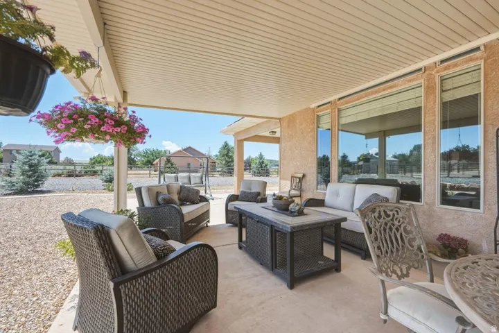 Covered patio with textured stucco walls and a smooth concrete floor