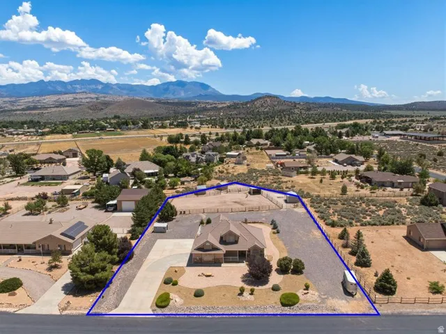 Single-family home with a paved driveway and an attached garage
